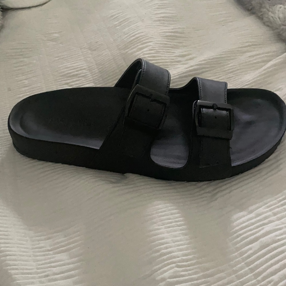 Flat black slip on sandals